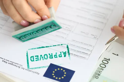 Approved stamp on a student visa application form